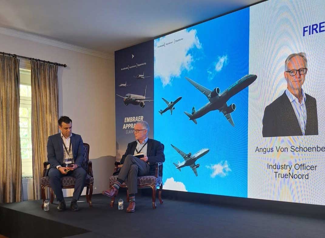 TrueNoord Industry Officer, Angus von Schoenberg talking with Oliver Gerg, Embraer SVP Global Leasing